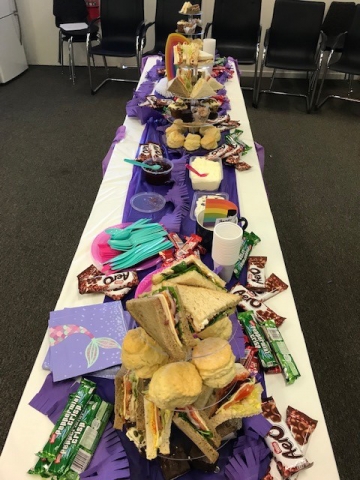 A table full of party food and snacks.