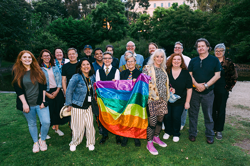 VincentCare staff holding a rainbow flag