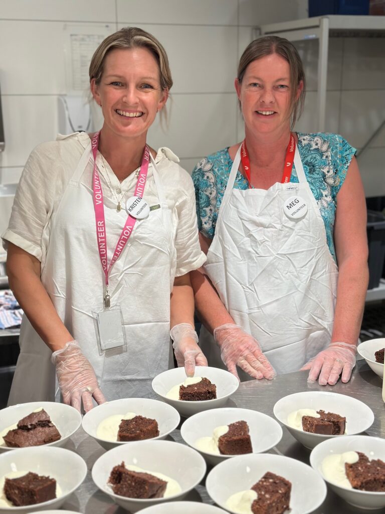 Kristen and Meg’s journey into volunteering at Ozanam House began with a shared curiosity and a desire to give back but it quickly became something much more meaningful. After first connecting through the Vinnies Berwick Pantry Van, the pair visited Ozanam House together and were immediately drawn to the warmth of the space and the sense of purpose it carried. What started as an interest soon turned into a regular commitment, with both now volunteering in meal service and often travelling in together, turning each shift into both a contribution and a catch-up.
For Meg, volunteering has also been a way to expand her understanding and build on her background in community support. She values the opportunity to learn, grow, and connect with both clients and fellow volunteers. Each shift brings something new, whether it’s a conversation, a shared moment, or a fresh perspective. The welcoming environment, ongoing training, and strong sense of appreciation make her feel part of something bigger.
What stands out most for both Kristen and Meg is the genuine care that fills Ozanam House. It’s in the small but powerful moments like when one client organised a birthday cake for another, creating a moment of celebration and belonging. These experiences highlight the deep sense of community that exists within the space, challenging assumptions and revealing just how diverse the experience of homelessness can be.
They both speak about the joy of simply being there for the people, the conversations, and the shared purpose. For Kristen, it’s also about setting an example for her children, showing them the importance of kindness and giving back. For Meg, it’s about connection, learning, and being part of a respectful and uplifting team.
Their message to anyone considering volunteering is simple: give it a go. It’s not just about helping others it’s about being part of a community where generosity, dignity, and humanity are felt every single day.
A heartfelt thank you from all of us at Ozanam House, VincentCare